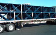 Flatbed shipment of pallet rack uprights, shipping teardrop pallet racking
